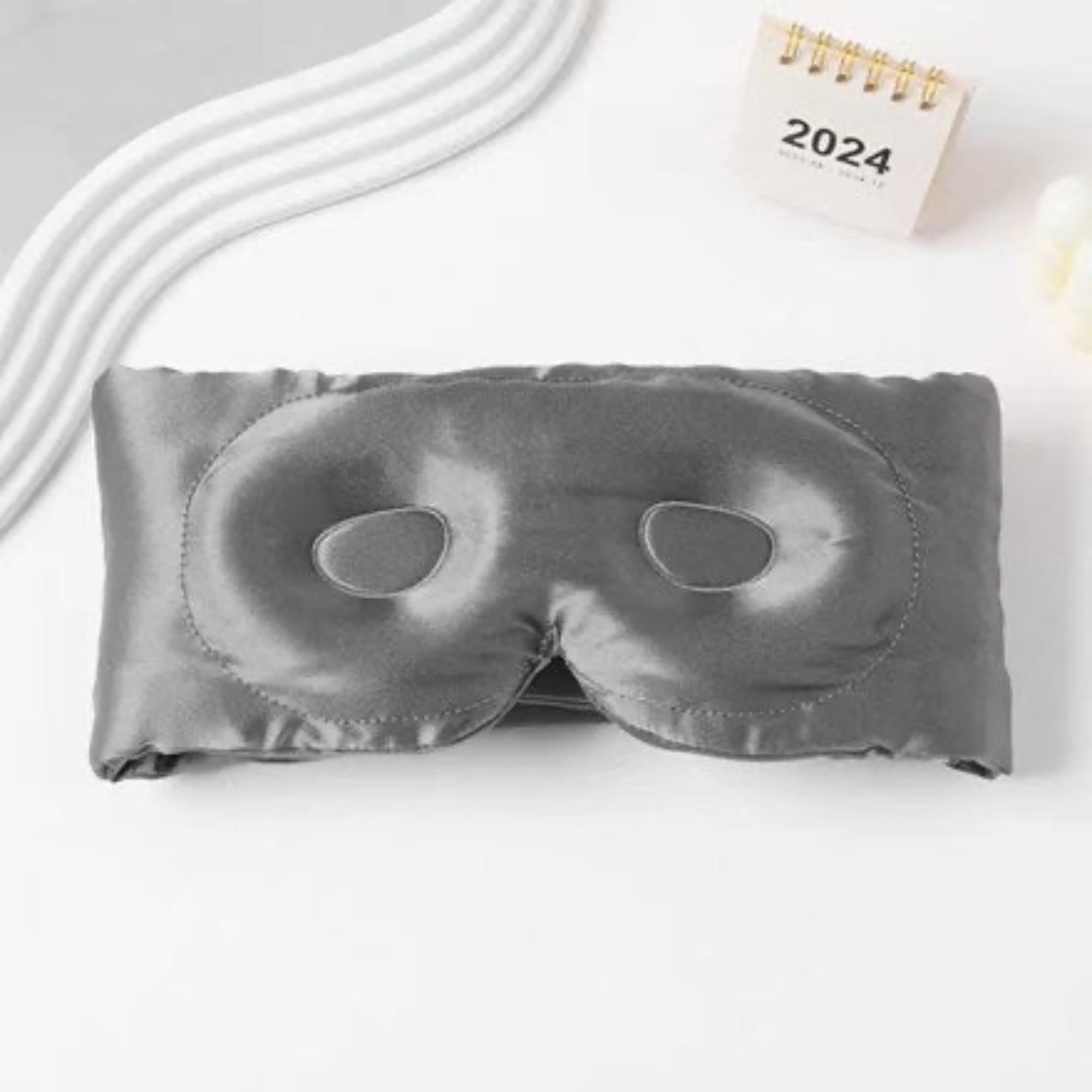 3D contoured Mulberry silk sleep mask made from Grade 6A silk, designed for complete blackout, eye comfort, and deeper restorative sleep.