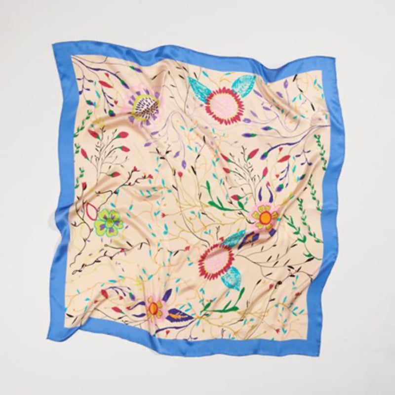 Luxury 90×90 Mulberry silk scarf, digitally printed from hand-painted artwork with a vibrant floral design and hand-rolled hem.